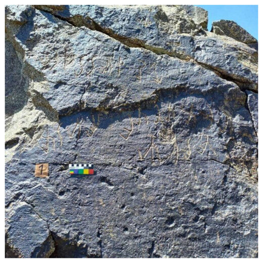 Characters on a rock in the Almosi Gorge in Tajikistan