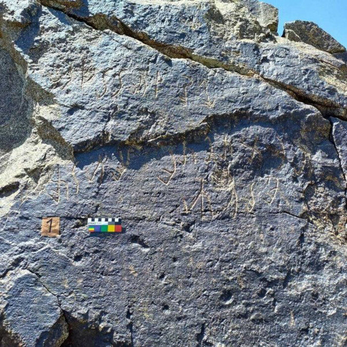 Characters on a rock in the Almosi Gorge in Tajikistan