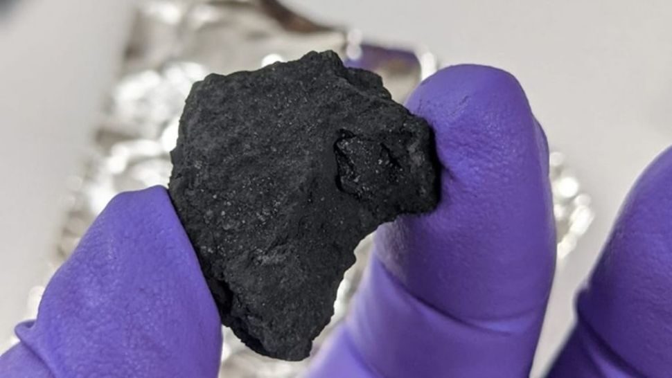 Click to enlarge tiny fragment of a meteorite