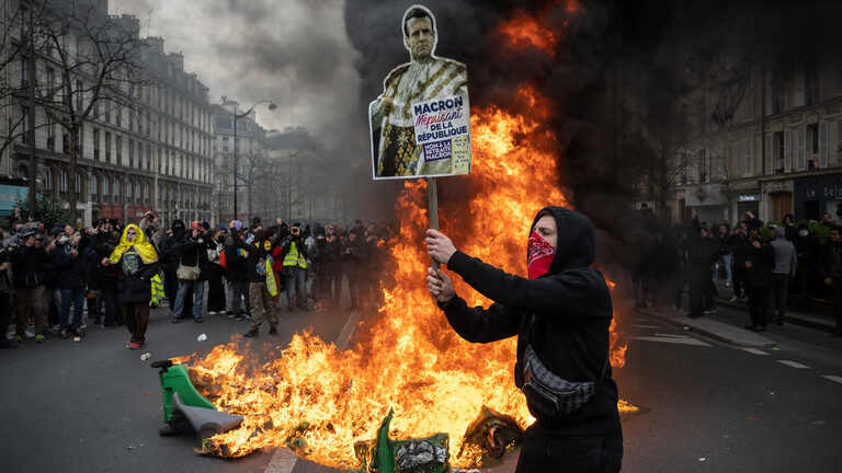 French protester, Macron placard, Macron protest