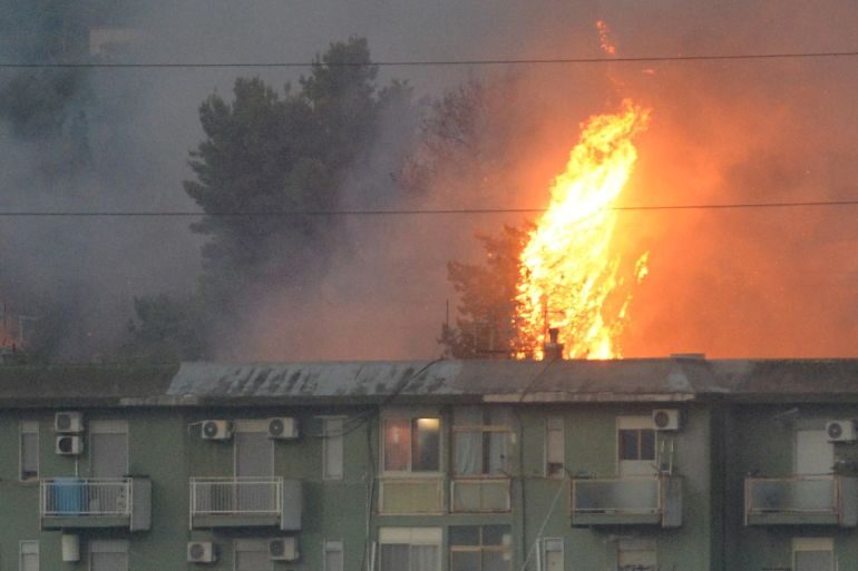 A fire burns in the area of Monte Grifone and the town of Ciaculli near Palermo, Sicily