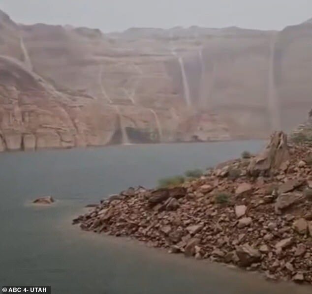 Waterfalls formed following severe storms on August 2 at Lake Powell, creating a spectacle for onlookers