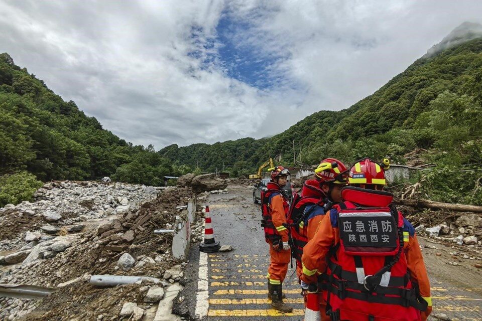 In this photo released by Xinhua News Agency, rescue workers gather at the aftermath of a mudslide in Weiziping village of Luanzhen township on the outskirts of Chang'an district, Xi'an of northwestern China's Shaanxi Province on Saturday Aug. 12, 2023.