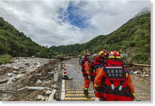 In this photo released by Xinhua News Agency, rescue workers gather at the aftermath of a mudslide in Weiziping village of Luanzhen township on the outskirts of Chang'an district, Xi'an of northwestern China's Shaanxi Province on Saturday Aug. 12, 2023.