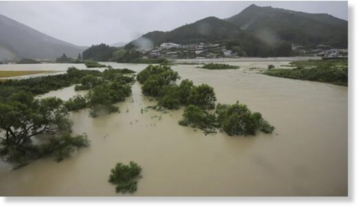 A swollen river as Typhoon Lan makes landfall in Shingu City, Wakayama Prefecture on Tuesday.