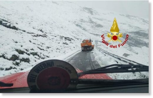 Click to enlarge lle dell'Agnello Alpine pass between Italy and France on Monday as the area was hit by unexpected summer snowfall.