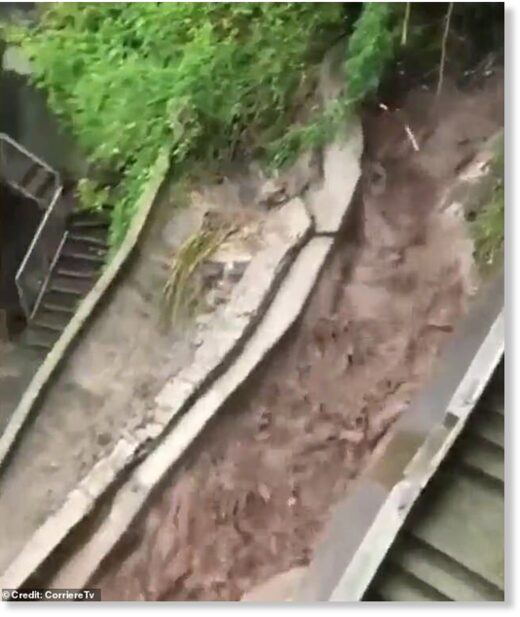 Click to enlarge A river of muddy water running towards a road in Blevio. Heavy rain and landslides have caused damage in the area