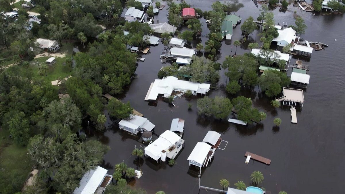 This aerial photo shows homes surrounded by floodwaters in Steinhatchee, Fla., Wednesday, Aug. 30, 2023, left behind by Hurricane Idalia.