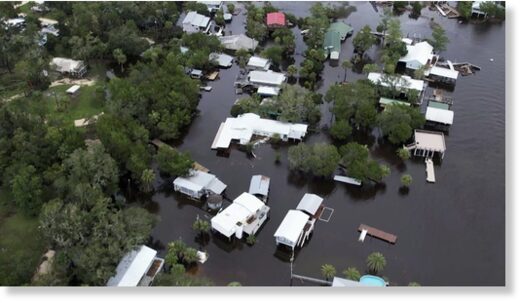 This aerial photo shows homes surrounded by floodwaters in Steinhatchee, Fla., Wednesday, Aug. 30, 2023, left behind by Hurricane Idalia.