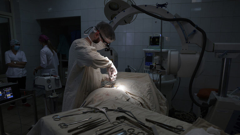 Doctors operate in a Military Hospital in Kiev District