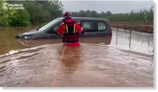 One man had to be rescued from his car by a firefighter in Spain's eastern Castelló province
