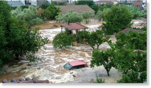 Click to enlarge Floodwaters cover a car and the yards of houses in Milina village, Pilion region, central Greece, Tuesday, September 5, 2023.