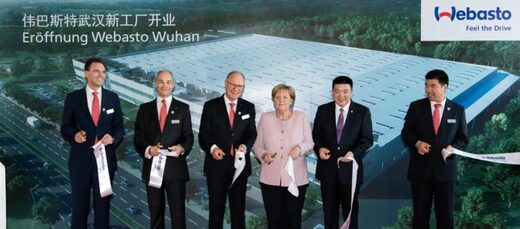Click to enlarge German Chancellor Angela Merkel webasto auto manufacturing