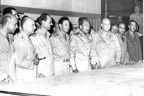 Click to enlarge Sadat with the military staff in the operations room of the 1973 War