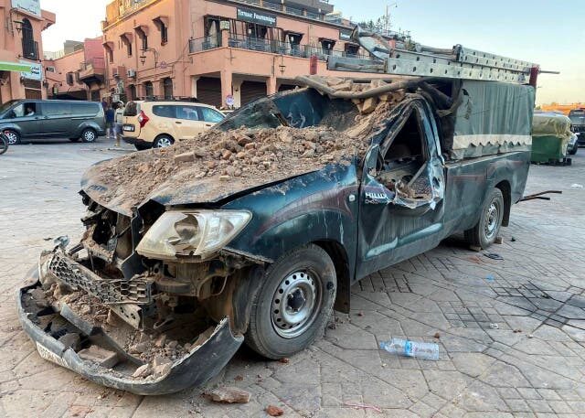A damaged vehicle is pictured in the historic city of Marrakech