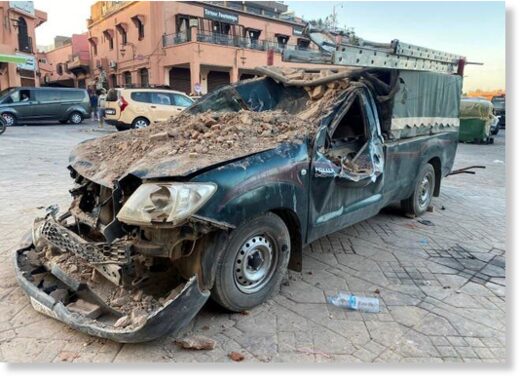 A damaged vehicle is pictured in the historic city of Marrakech