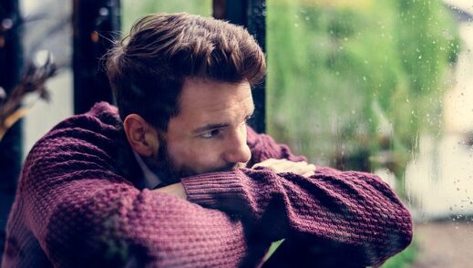 frustrated liberal man contemplation window