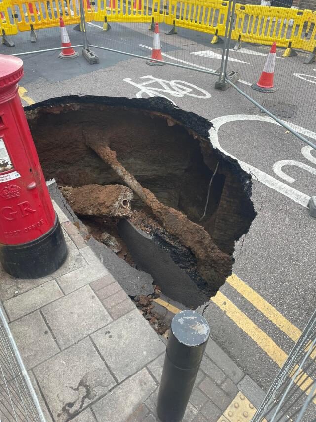 Residents initially used wheelie bins to block off the sinkhole, which emerged on Monday morning in Eltham.