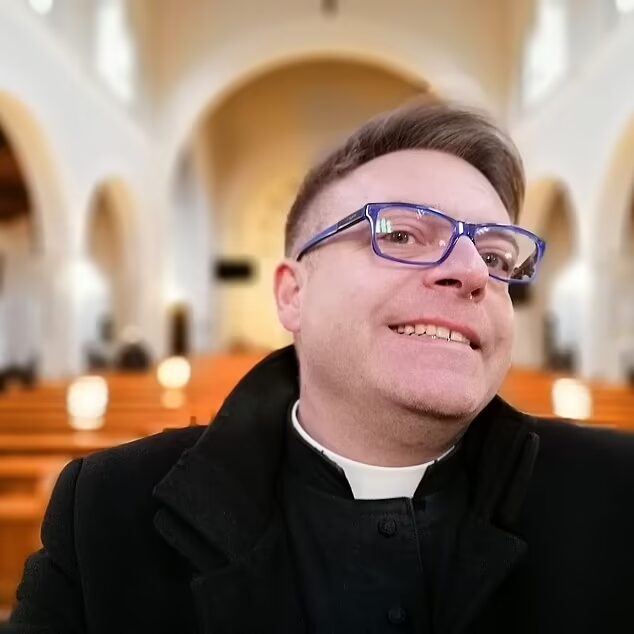 Click to enlarge Father Tomasz Zmarzły