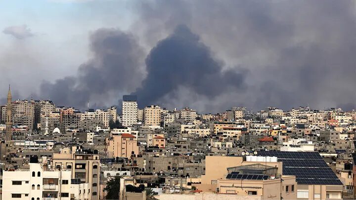 Smoke rises over Gaza City on October 7, 2023 during Israeli air strikes.