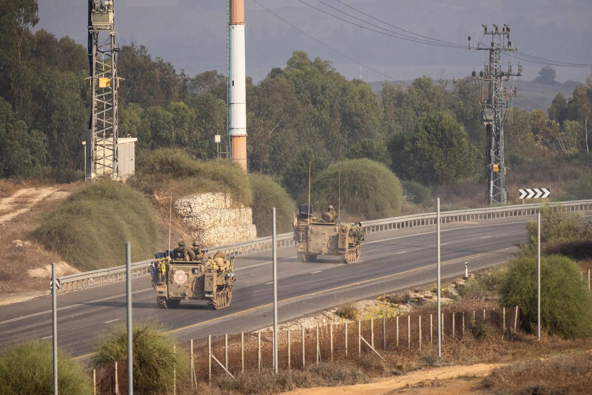 Click to enlarge Israeli armored vehicles near the border with southern Gaza on Saturday.