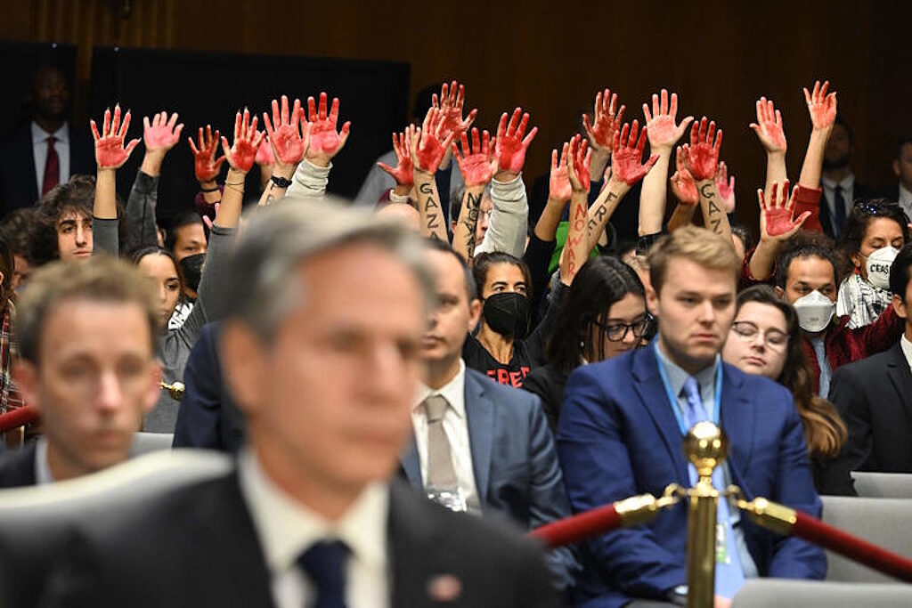 red hands protest gaza blinking hearing funding israel