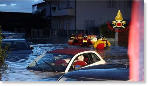 Click to enlarge Italian firefighters work in flooded streets in the