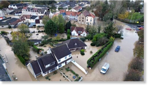 An aerial view shows a flooded area as the La Liane River overflows in Pont-de-Briques, near Boulogne-sur-Mer, after heavy rain caused flooding in northern France on November 7, 2023