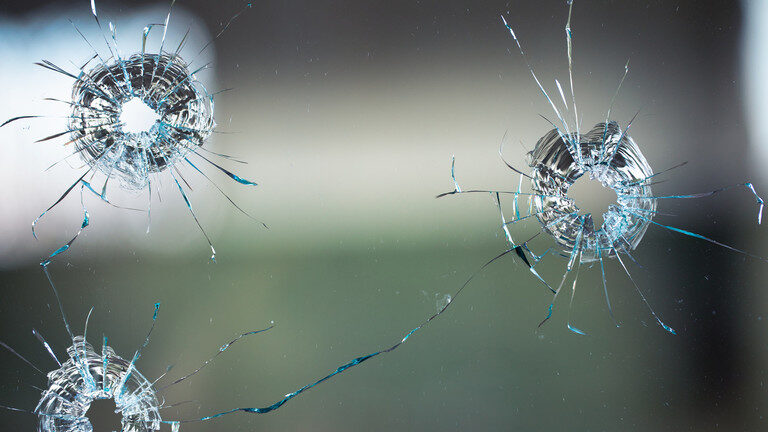 bullet holes glass