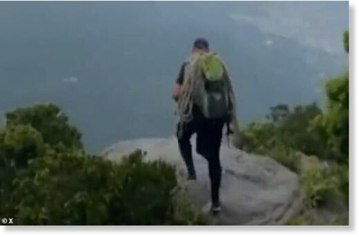 Click to enlarge Leilson de Souza was standing over a rock when he was struck by lightning at Tijuca National Park in Rio de Janeiro. He was declared dead on the scene