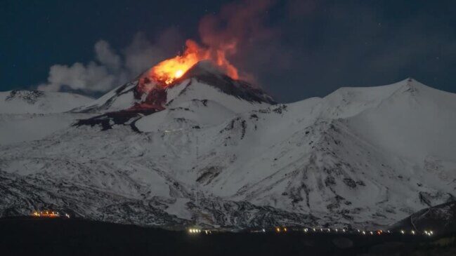 Sizzling hot lava streamed down from the snow-covered slopes of Mount Etna late on Friday (November 24).