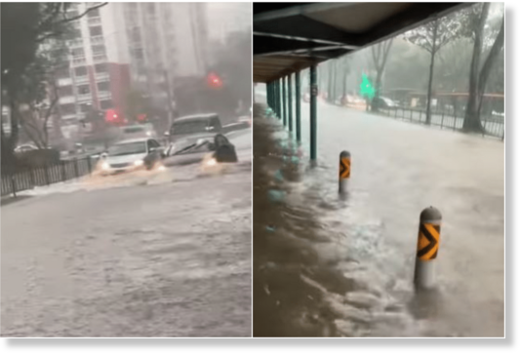 Click to enlarge The water level in Boon Lay Avenue almost reached the height of the seats of a bus stop, with vehicles travelling slowly along that road.