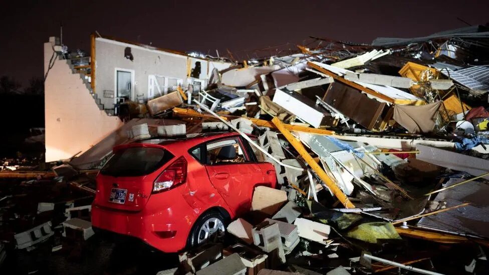 A car was seen buried under the ruins of a home in Hendersonville