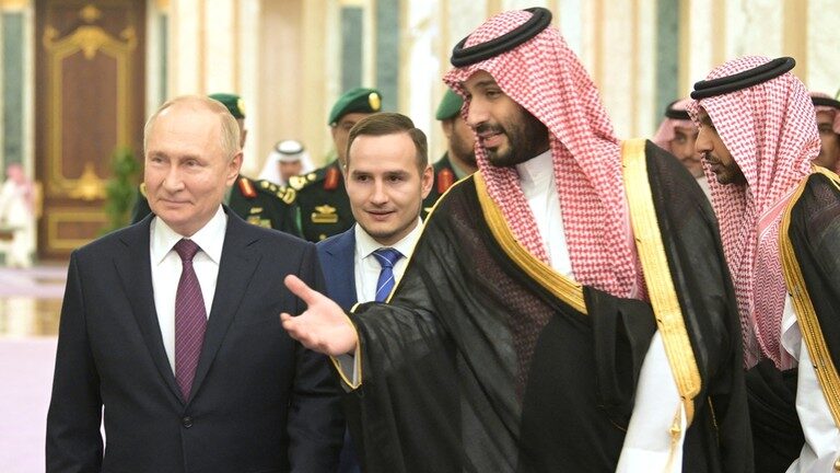 Click to enlarge Russia's President Vladimir Putin and Saudi Crown Prince Mohammed bin Salman