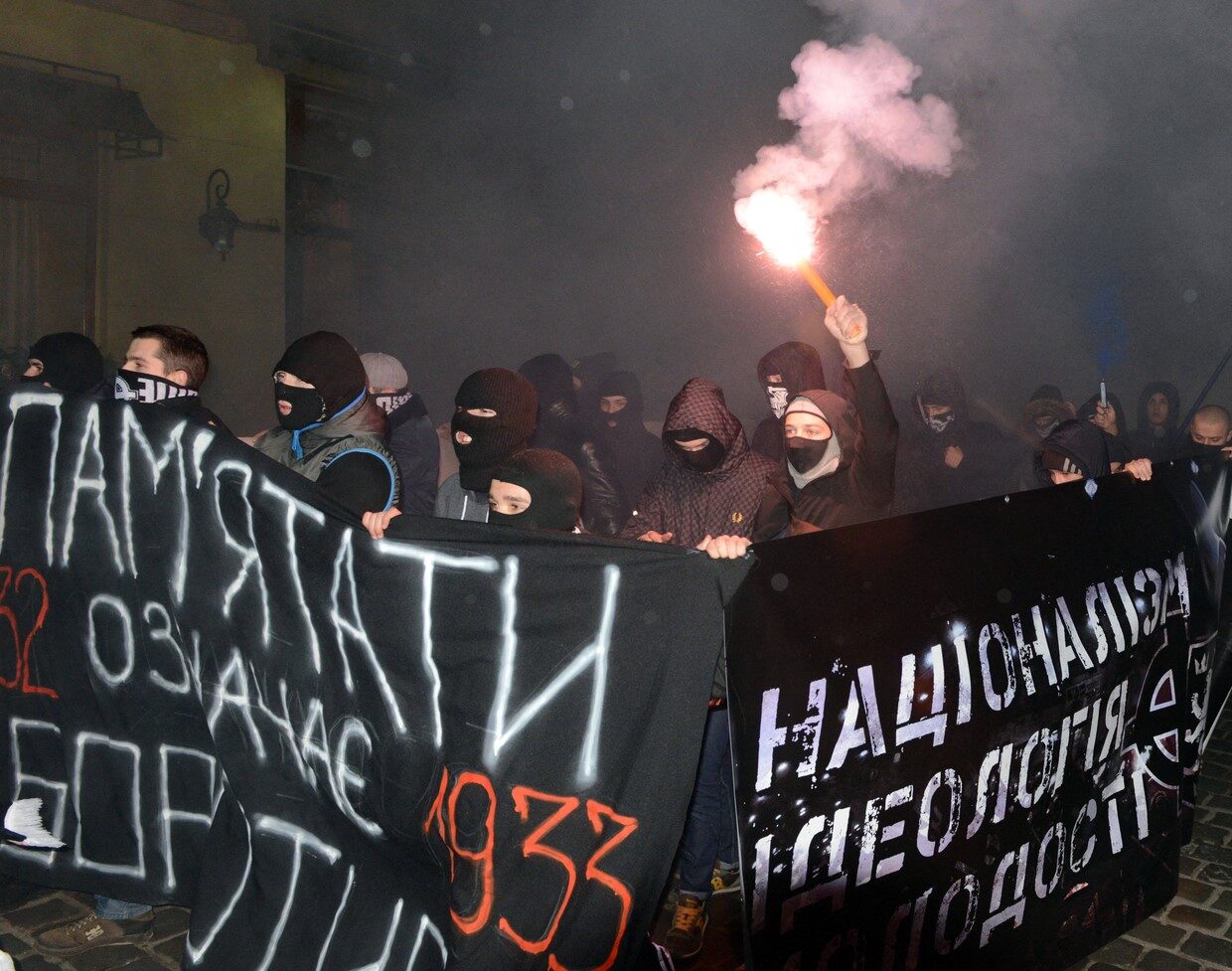 Young ultra-nationalists carry placard reading 