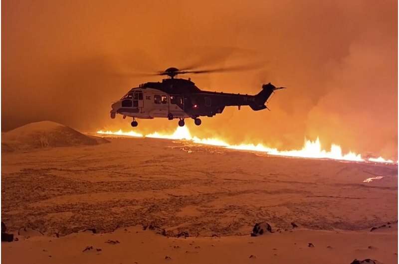 Click to enlarge This image made from video provided by the Icelandic Coast Guard shows its helicopter flying near magma running on a hill near Grindavik on Iceland's Reykjanes Peninsula sometime around late Monday, Dec. 18, or early Tuesday, Dec. 19, 2023