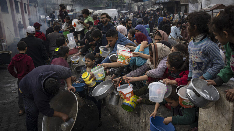 Palestinians line up for food in Rafah, Gaza, December 21, 2023