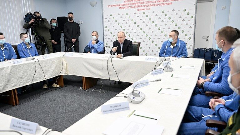 Russian President Vladimir Putin meets with participants in the special military operation