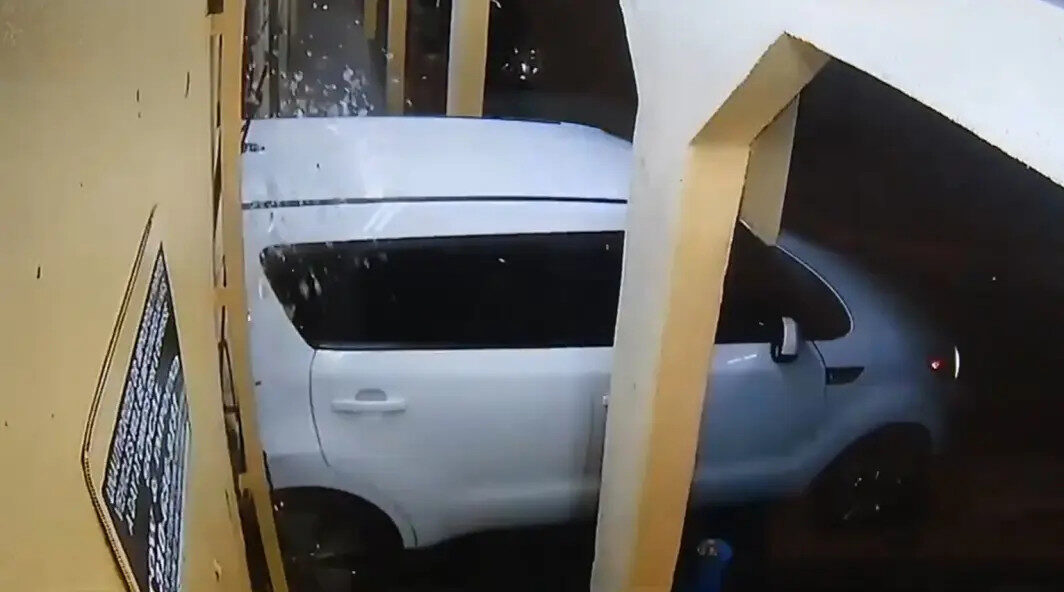 Click to enlarge white Kia smashes storefront, Compton, Ruben’s Bakery & Mexican Food