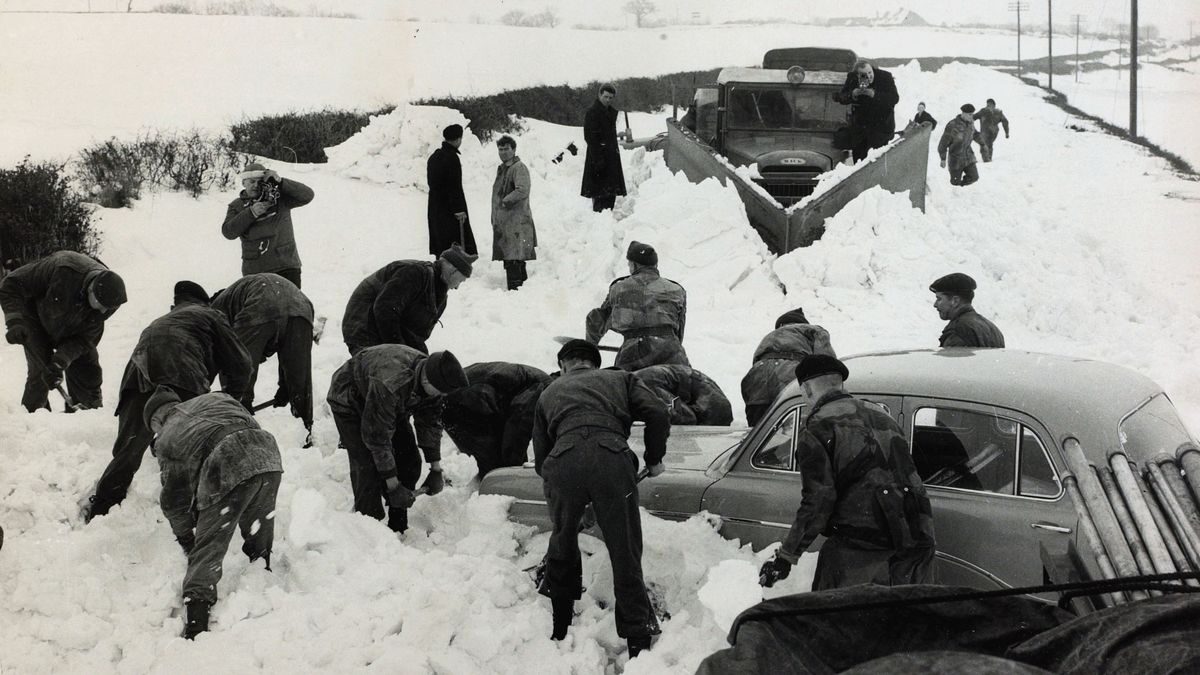 Royal Marines and snowplough captured trying to clear snow on the Whiddon Down to Exeter Road in 1963 (
