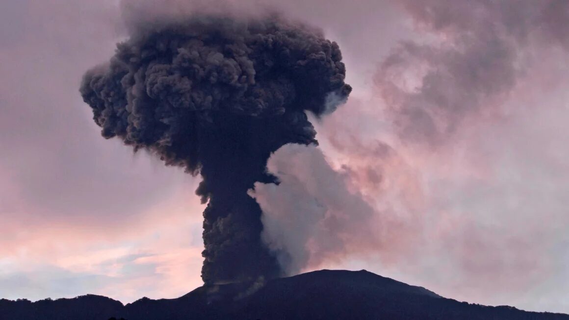 Mount Marapi spews volcanic material from its crater during an eruption in Agam, West Sumatra, Indonesia, on January 14, 2024.