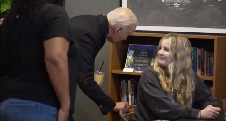 biden whispers in young girl's ear