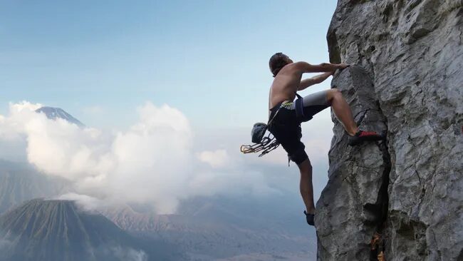Click to enlarge man climbing mountain