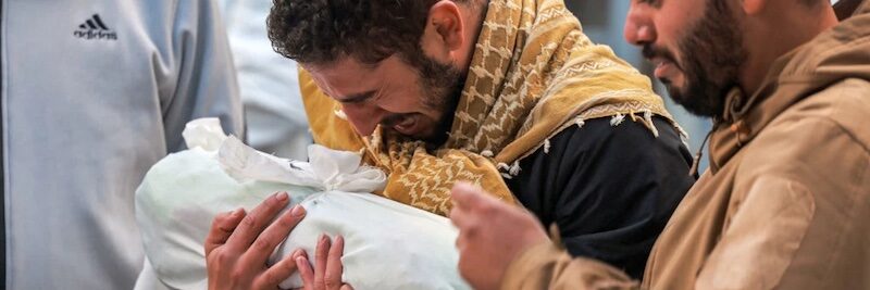 Click to enlarge man mourns in gaza