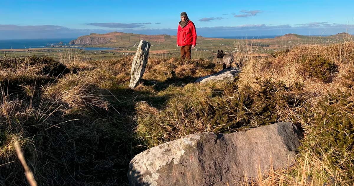 Billy Mag Fhloinn with the remnants of the tomb.