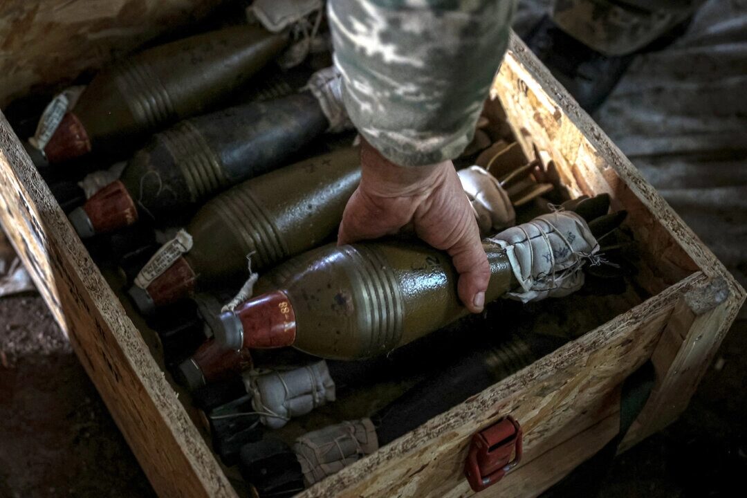 A Ukrainian soldier prepares mortar shells at a position along the front line in the Donetsk region on Sept. 26, 2022, amid Russia's invasion of Ukraine.