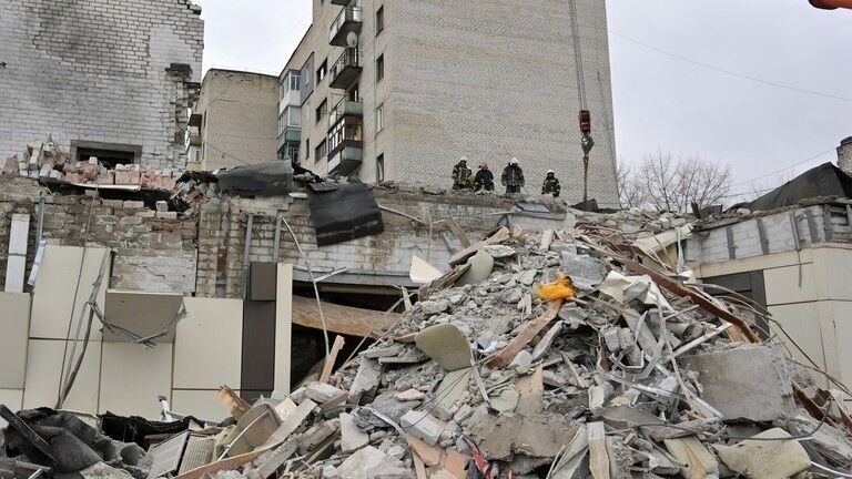 Click to enlarge Rescuers searching for survivors