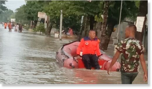 The road in Grobogan Regency, Central Java, experienced flooding due to high rainfall and overflowing local river water.