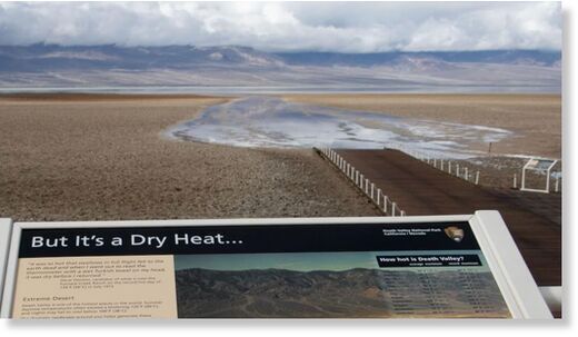 A sign at Badwater Basin describes Death Valley as a hot, dry place.