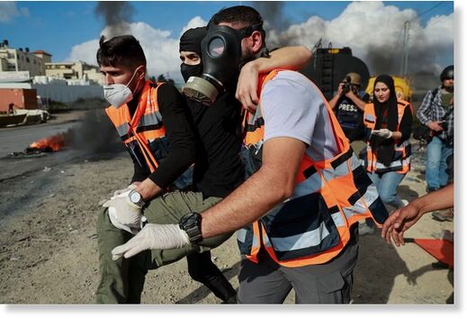 Emergency services on duty at a West Bank protest against Israeli occupation near Ramallah. Reuters  Emergency services on duty at a West Bank protest